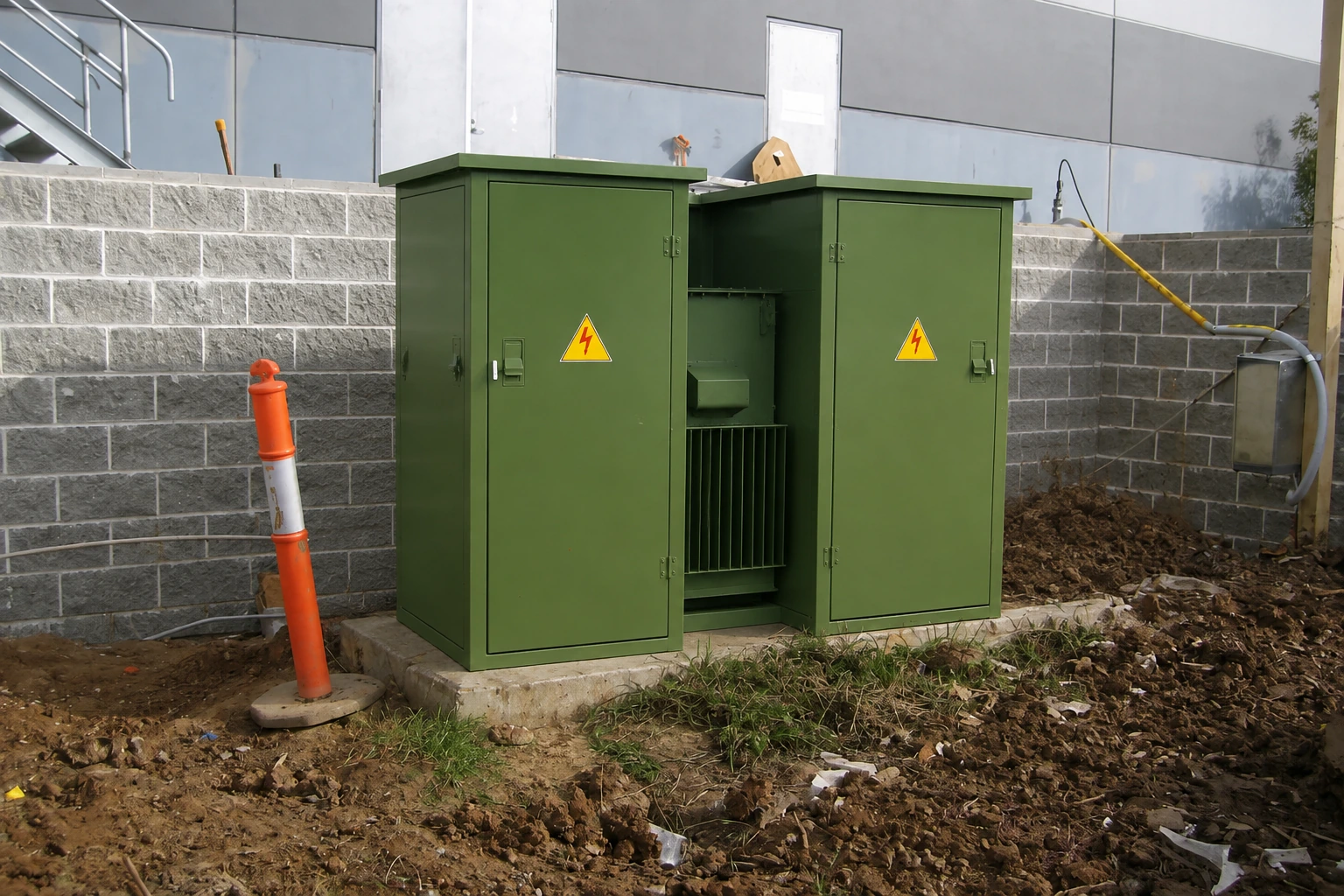 Combined transformer beside a block wall — reference-based edited scene