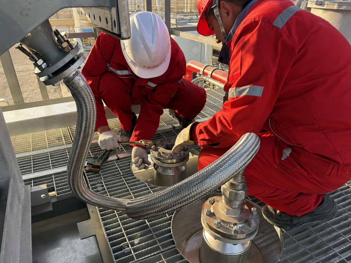 Technicians installing a Desalter HV Feedthrough on site