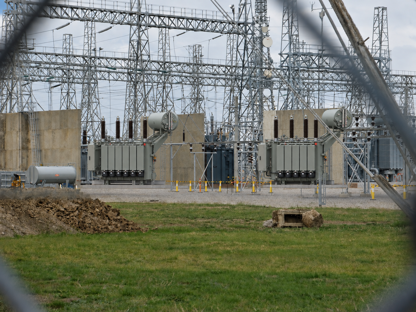 Illustrative view of power transformers in a high-voltage switchyard